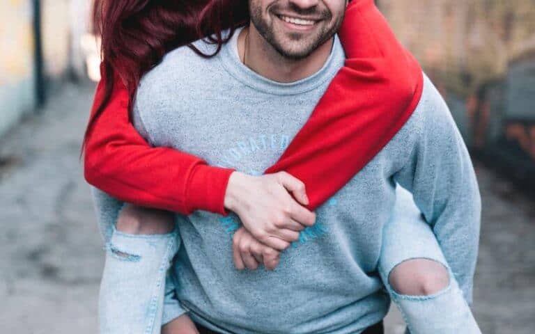 guy giving girl a piggyback