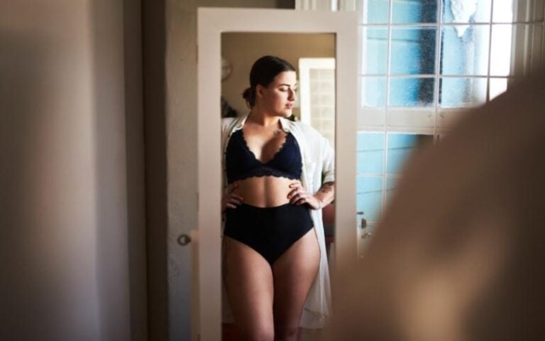 woman posing in mirror