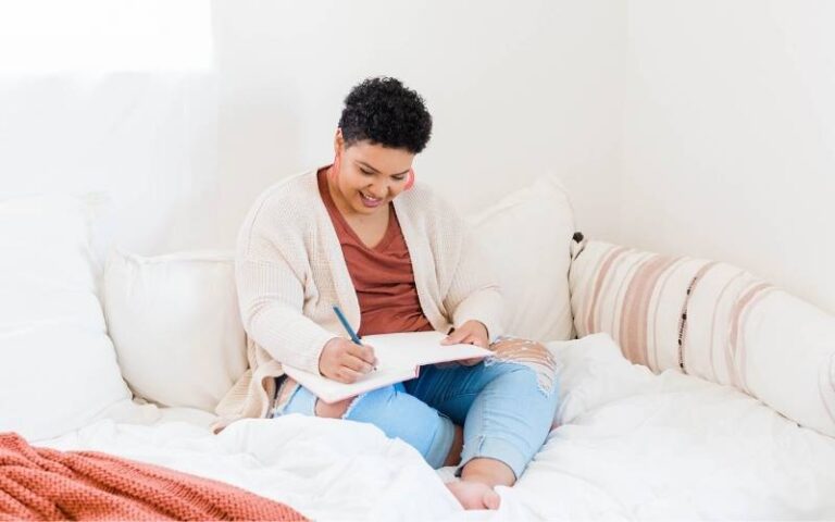 woman writing in journal