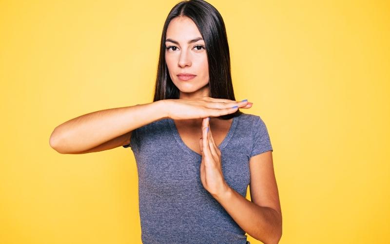 woman showing stop with hands