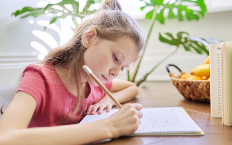 girl writing in journal