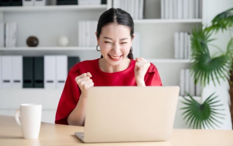 positive happy woman at laptop