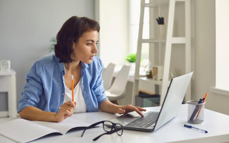 woman focused on laptop