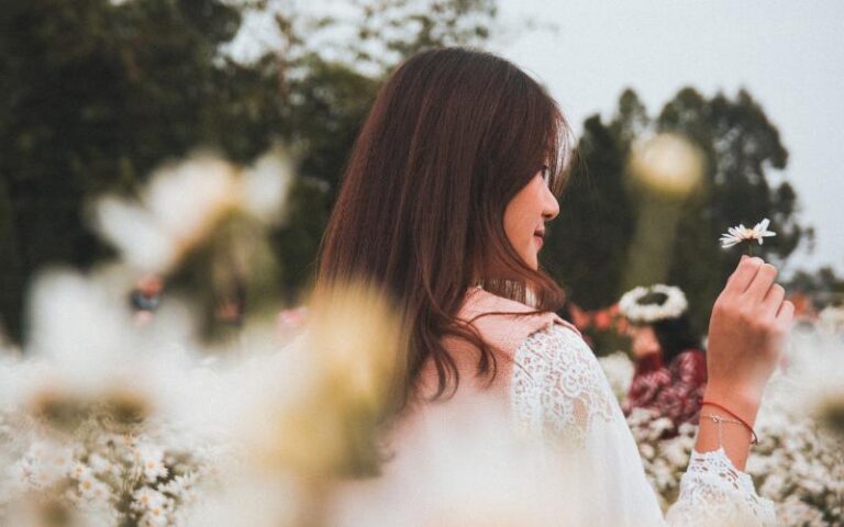 woman in field of spring flowers