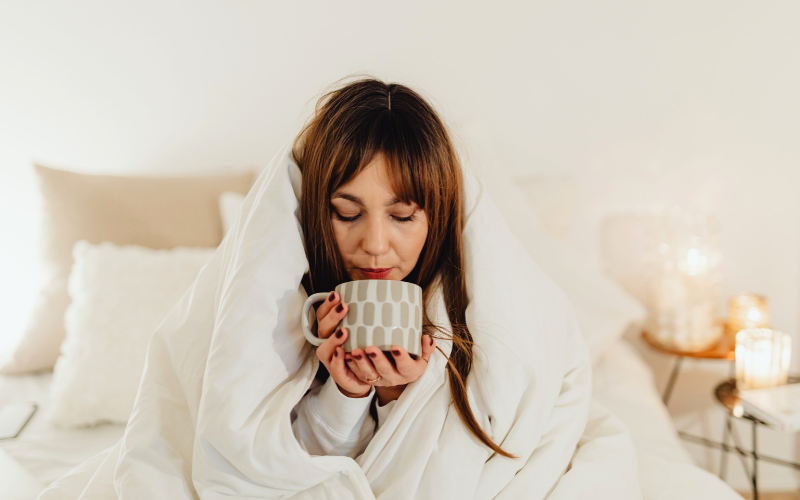 woman in bed with tea
