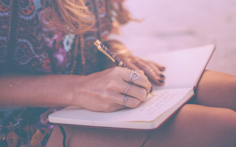 woman writing in journal